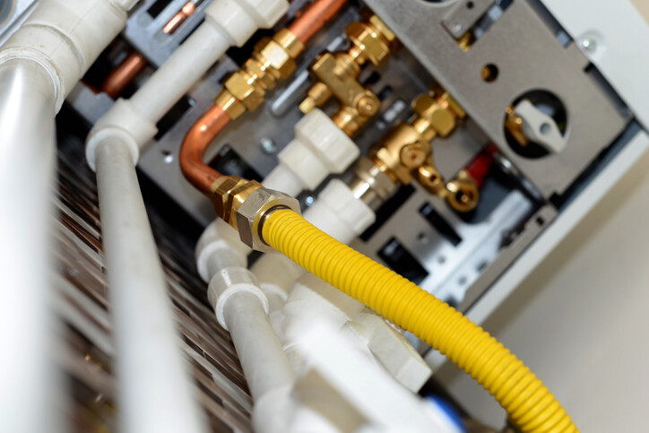 central heating pipes beneath boiler