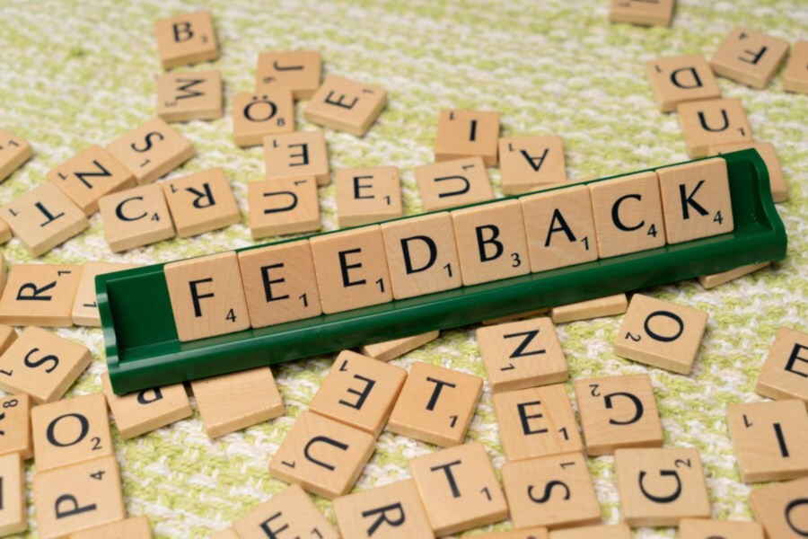 scrable letters spelling the word feedback