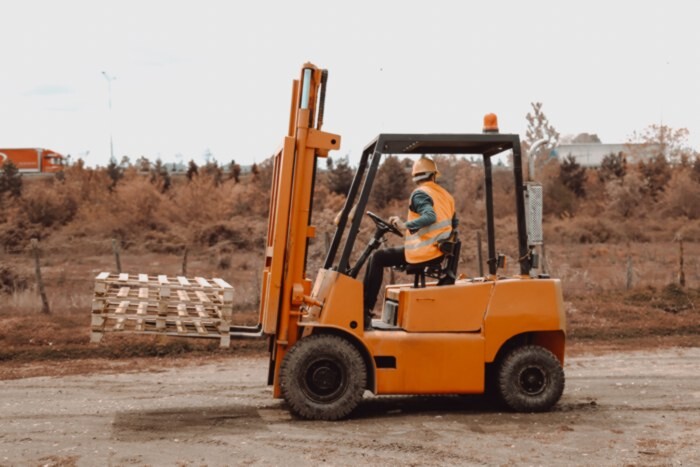 forklift being driven by forklift