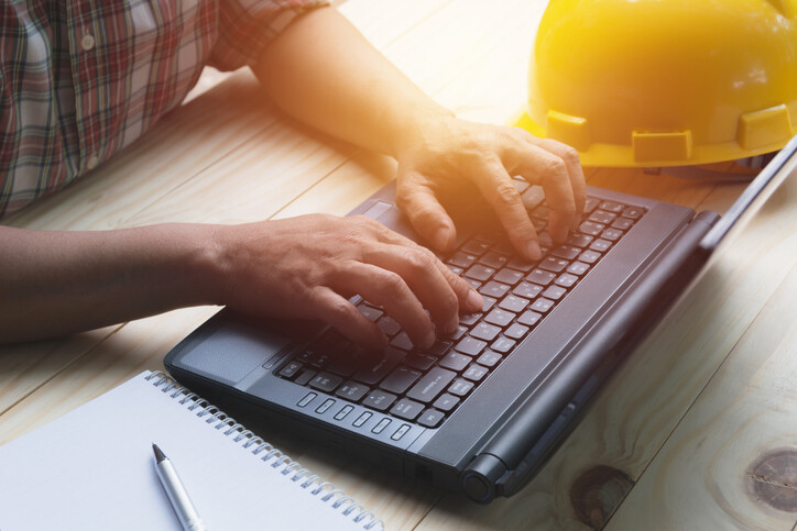 hands typing on keyboard