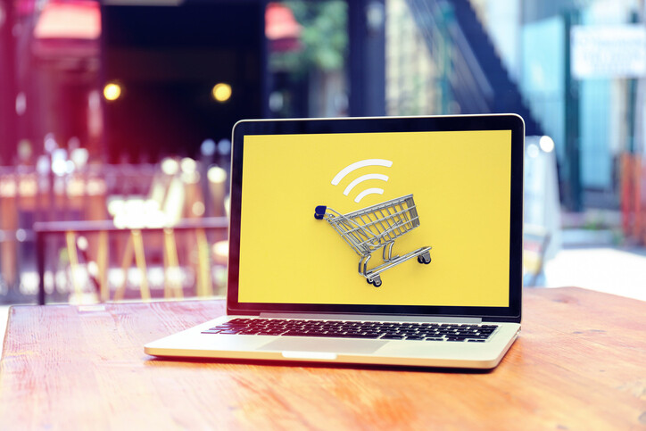 image-of-shopping-cart-on-yellow-ackground-on-laptop-screen