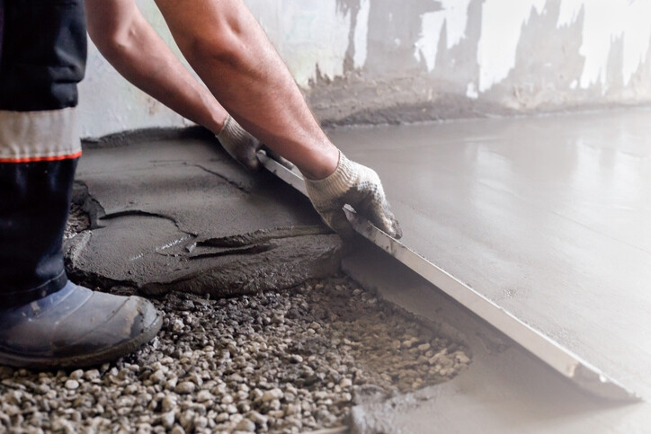 manual tamp being used to smooth fresh concrete floor (1).jpg