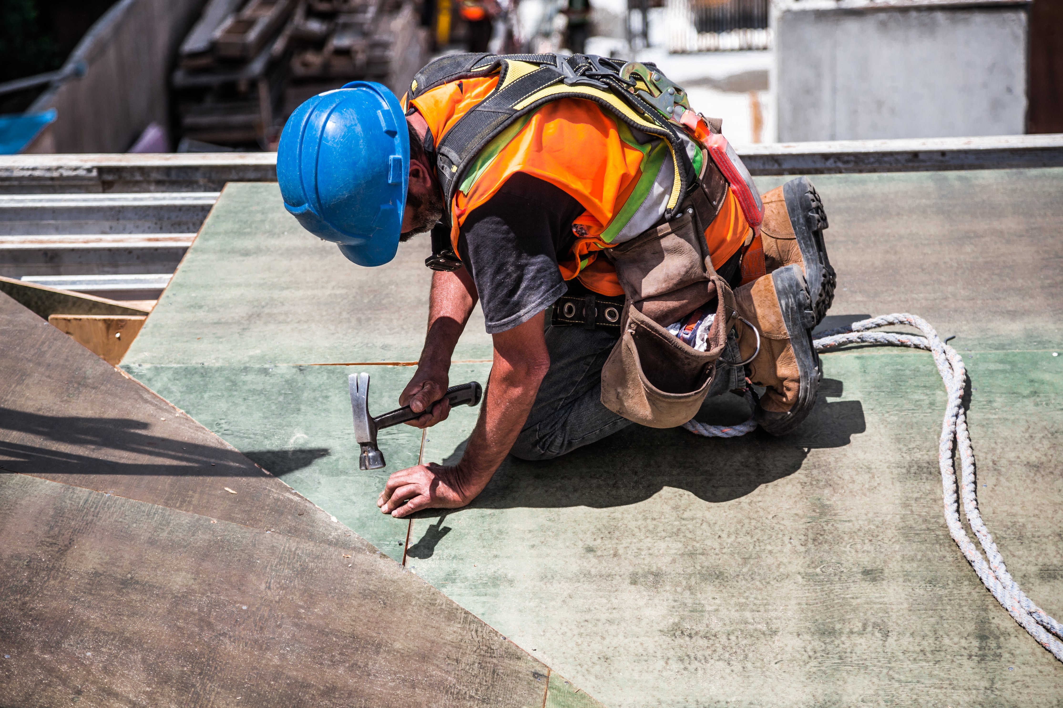 choose drogheda hire company - construction worker on roof working