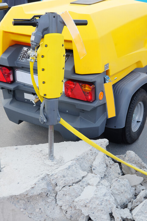Road compressor and air breaker stock image