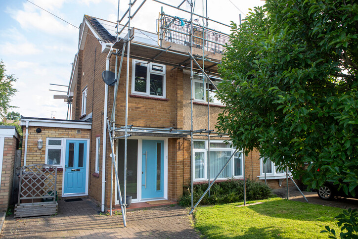 scaffolding erected outside English semidetached house