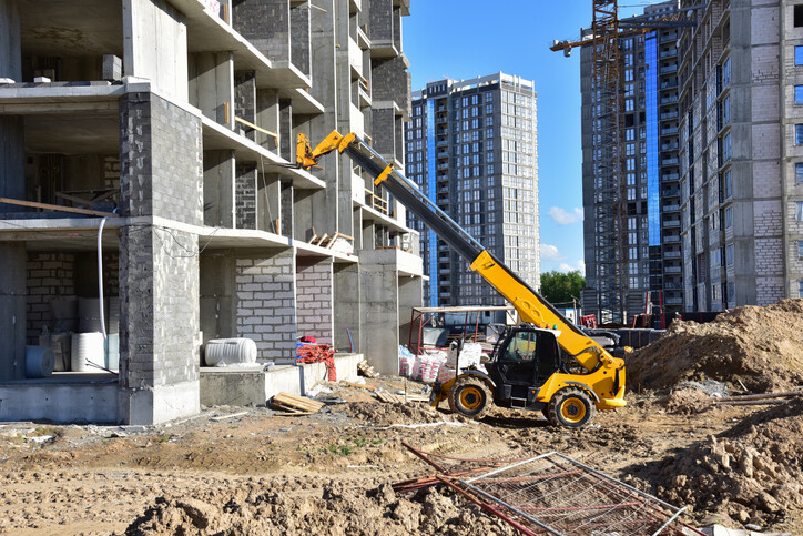 yellow teleporter elevating material on a construction site
