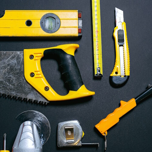 A selection of yellow hand tools