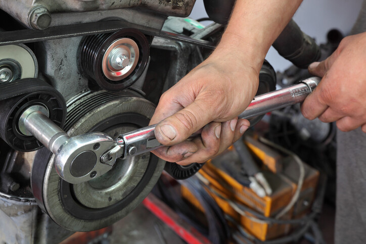 Torque wrench in use on engine repair