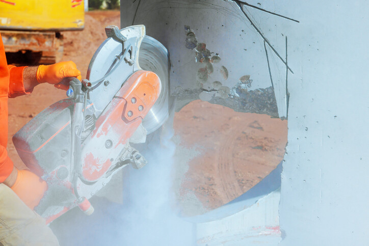 Wall chaser cutting into concrete wall